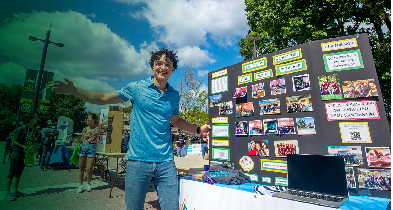 A 番茄视频 student shares information about their volunteer organization on the Fairfax Campus.